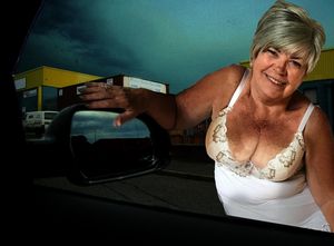 Sandy Ward talking to a stranger in his car.