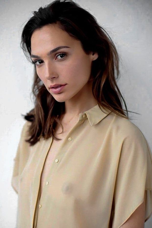 Gal Gadot is wearing a sheer unbuttoned blouse so thin you can see the dark brown areolas & nipples of her itty-bitty-kiddie-titties