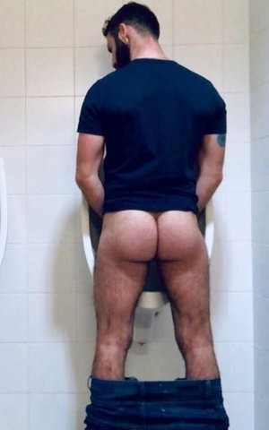 Showing his ass in the men's room
