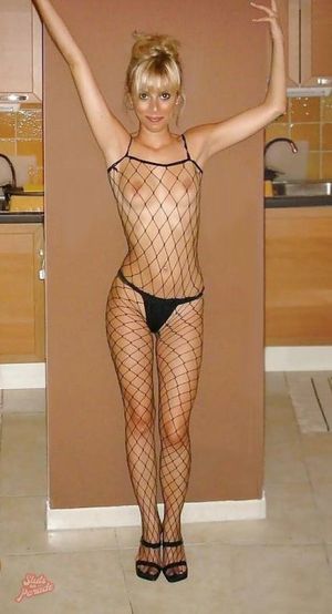 Topless amateur blonde in fishnet bodystocking