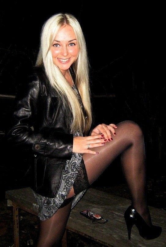 Cheerful blondie shows her stockings