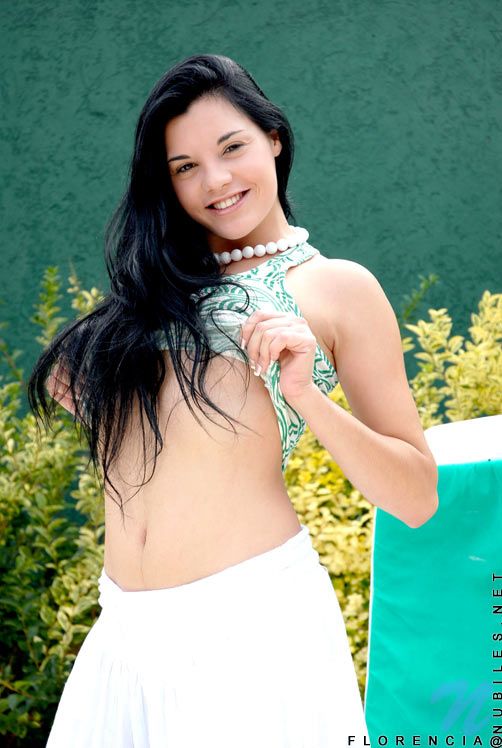 Hot teen Florencia posing outdoors while sitting and getting Hotter and Naughtier #1