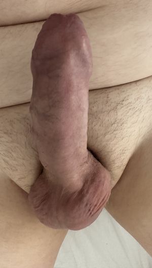 Hard uncut cock standing to attention