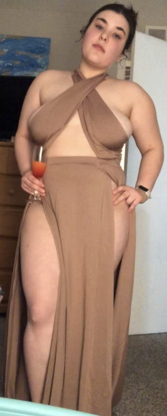 Thicc chick in a naughty getup drinking and feeling sexy.