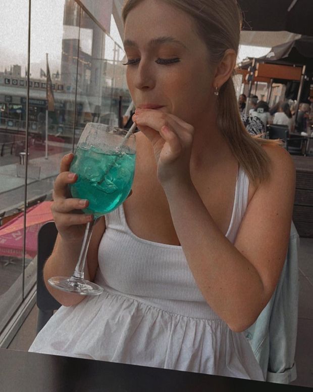 Cute Megan enjoying her drink