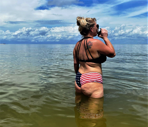 Having a cool Coors Lite soaking in the sun with water lapping on my pussy! Who could ask for more? Well maybe a big black cock!