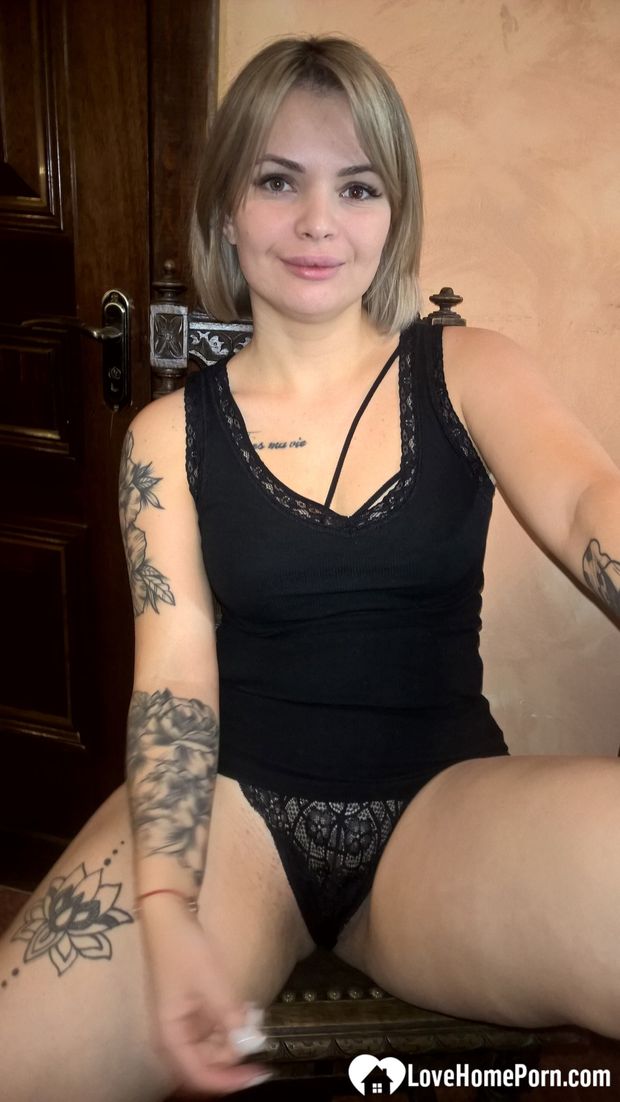 Short-haired hottie shows her small perky tits