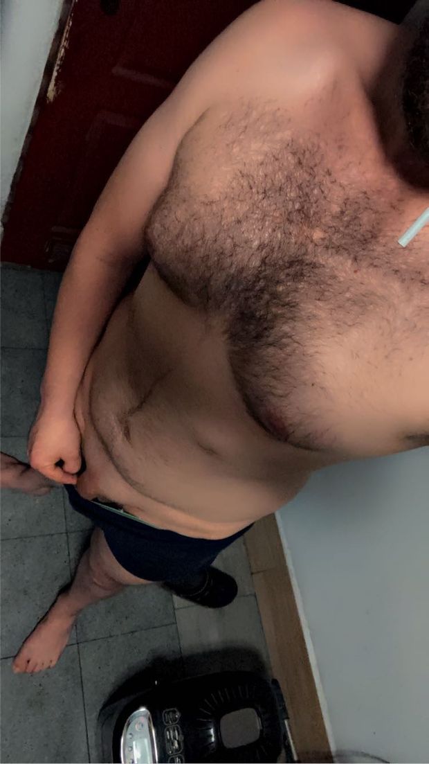 smoking a cigarette half naked