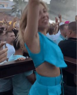 Sydney Sweeney bouncing at a concert
