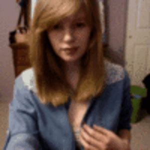 red haired sweetie shows titties