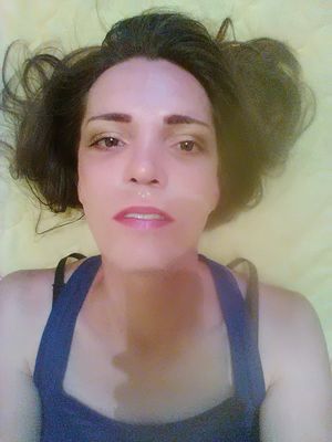 Horny shemale gives herself a facial