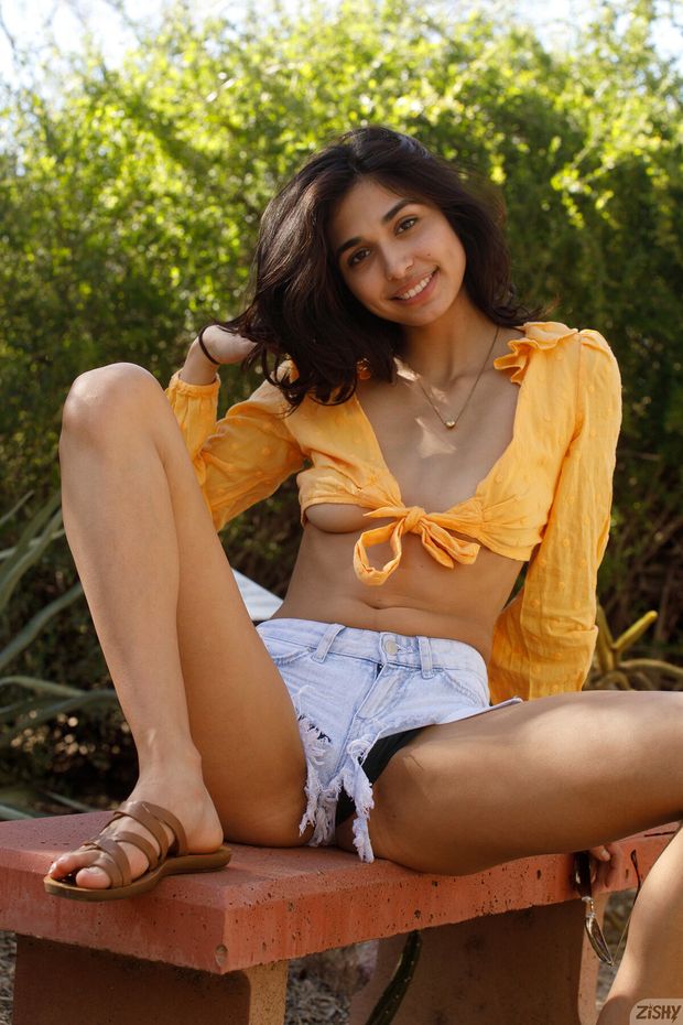 Sexy non nude brunette on a bench