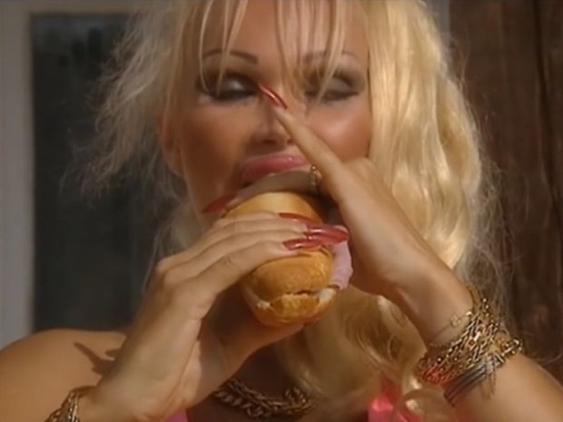Eating a sandwich.