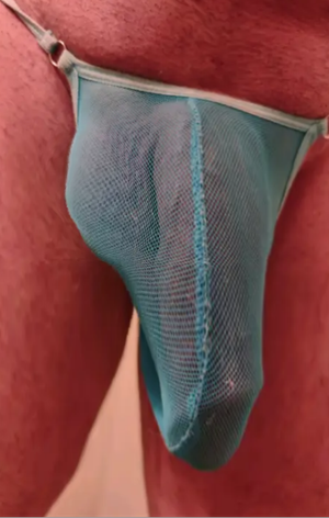 I got my cock and balls squeezed into this tiny thong. fits great