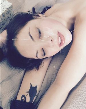 Pretty amateur brunette with her face covered in cum