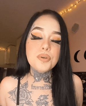 Sexy tattooed brunette spits on camera
