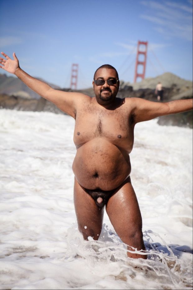 Naked man in the surf