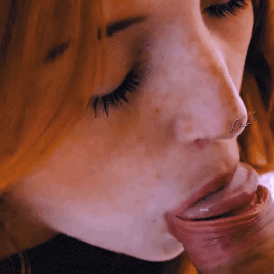 Ginger giving some TLC to a hard cock