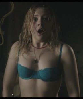 Shocked cutie in a little bra with little titties