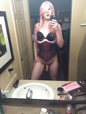 Crossdresser in lingerie top showing her body and cock in the mirror