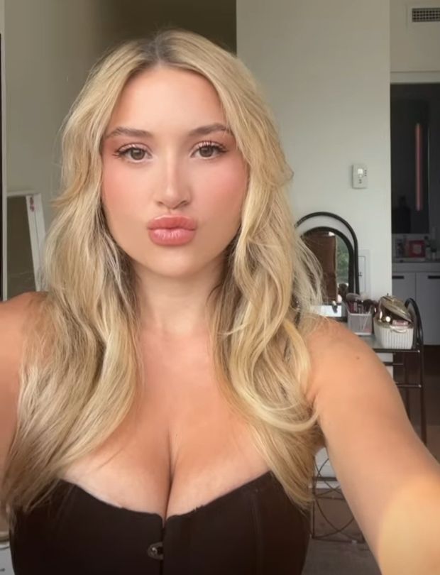 Claire black top duckface selfie
