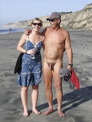 Naked man on a beach with a clothed woman