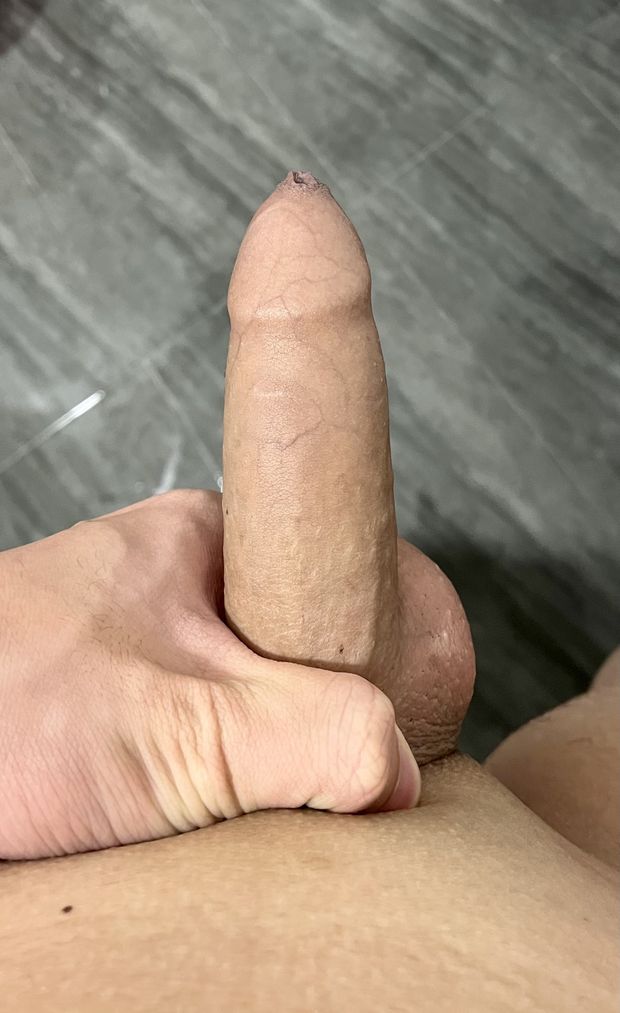 Nicely shaven cock filled with load of cum