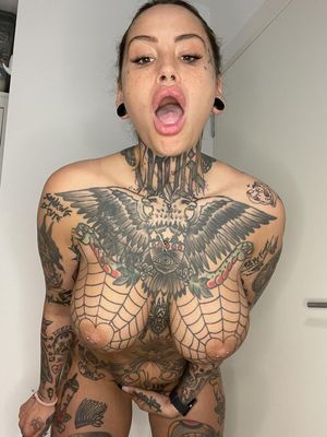 Busty tattooed MILF