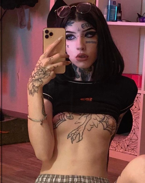 Gothic teen with tattooed small tits looks too damn sexy