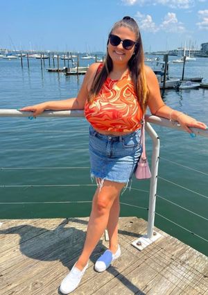 Alexa orange top on boardwalk