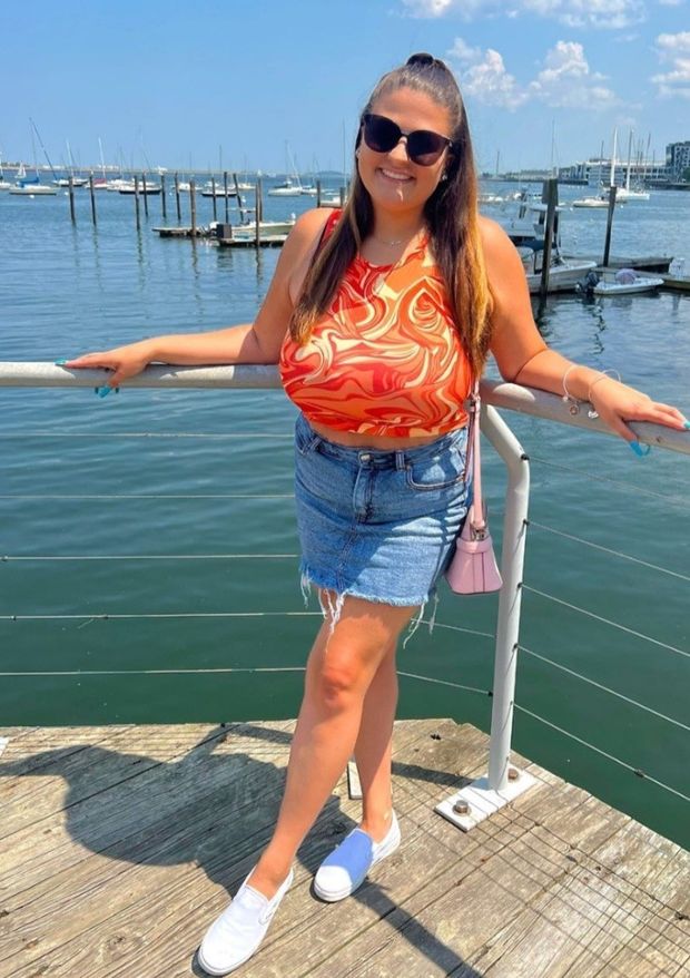 Alexa orange top on boardwalk