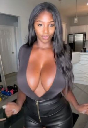 Ellie Mae black outfit cleavage