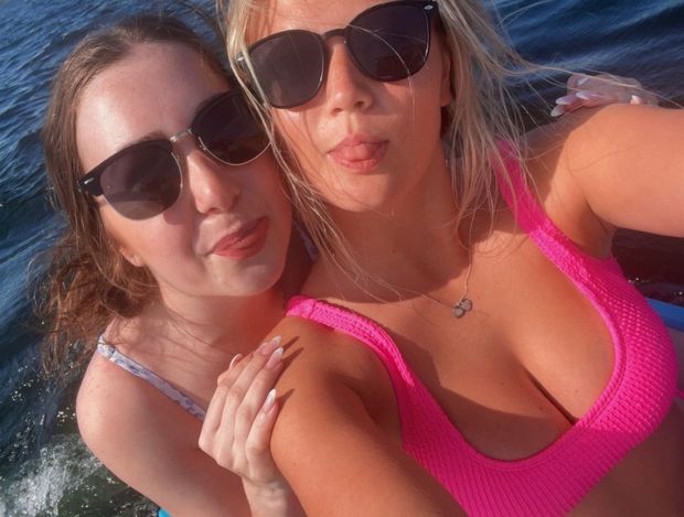 Naomi & friend pink top cleavage selfie