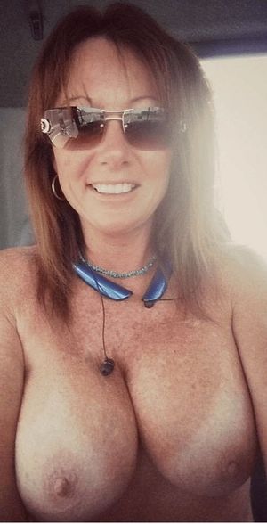 Hot brunette mature milf babe with a freckled chest!