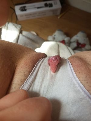 Squeezing her clit through her panties