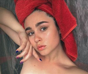 A beautiful teen has just taken a bath.