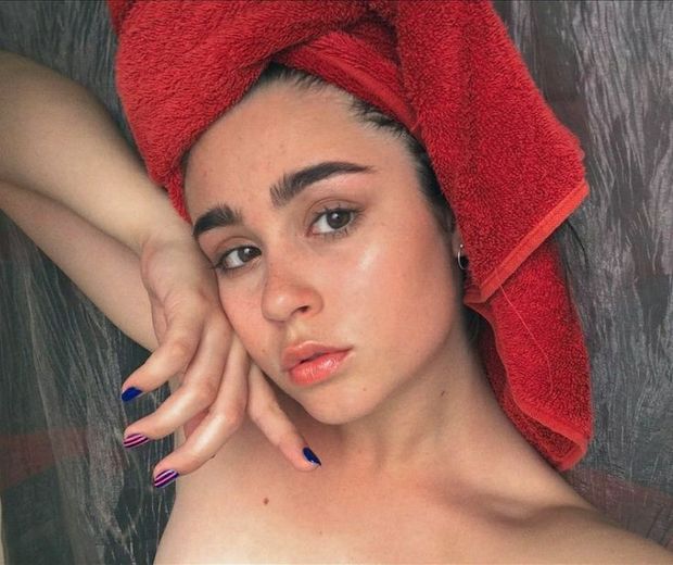 A beautiful teen has just taken a bath.
