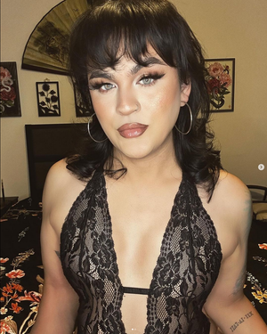 Stunning sissy with black hair and piercing eyes