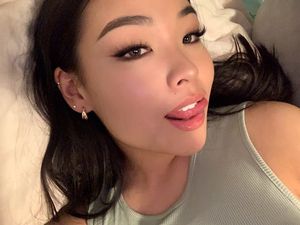 cute asian showing tongue