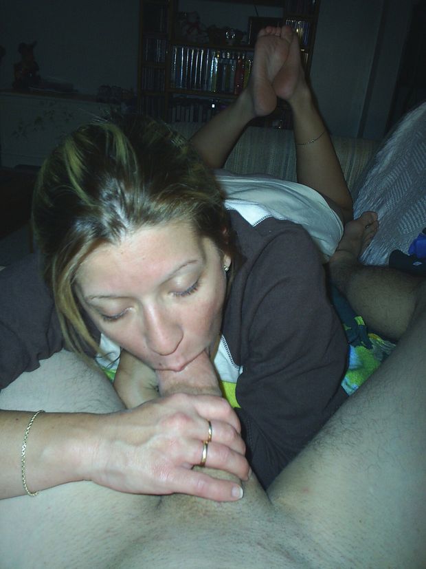 Clothed amateur brunette sucking cock with her feet up