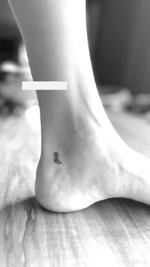 Tattoo of a boot.