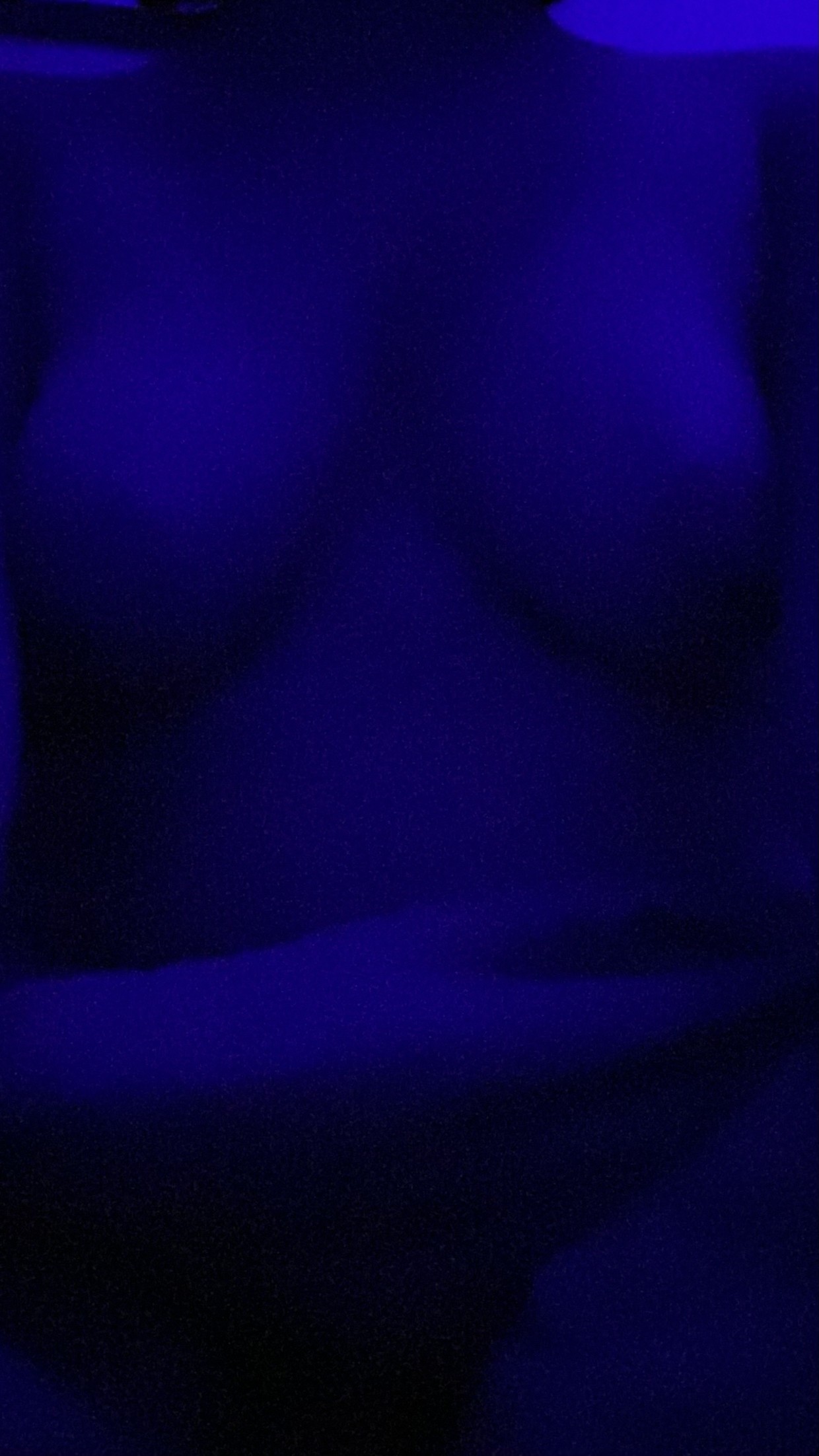 tits in a dark room