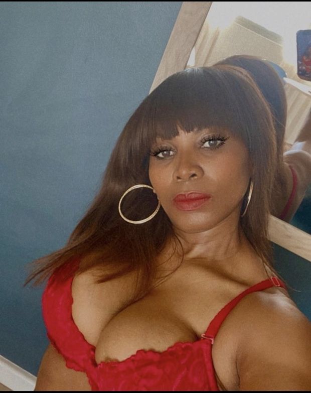 Showing off her Cleavage in her Red bra