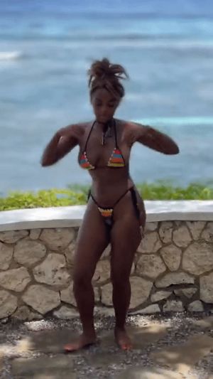 Janelle Monae dancing in a bikini