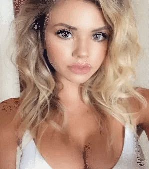 Pretty blonde with big tits. Name?