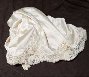 What is all over that Lacy Slip?