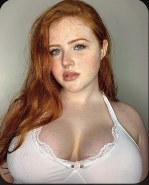 Redhead with massive tits