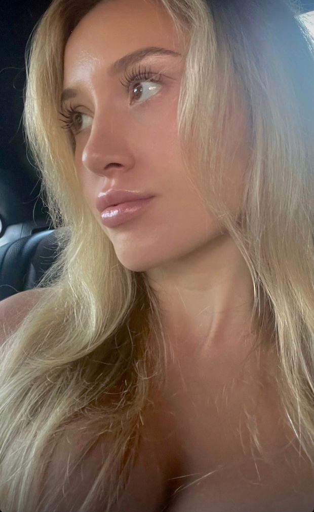 Claire selfie looking away in car
