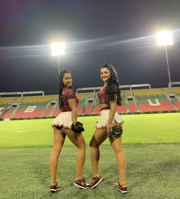 two latinas in miniskirt