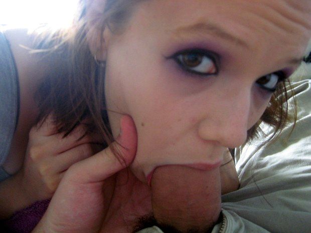 Close-up shot of an amateur brunette with some cock in her mouth